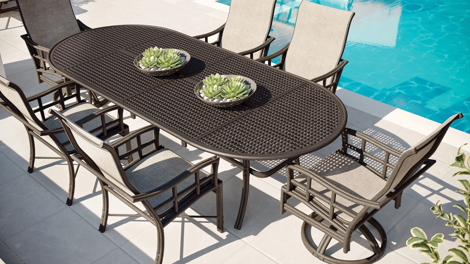 Resort Fusion Sling outdoor furniture dining table set from Castelle on a patio next to a pool