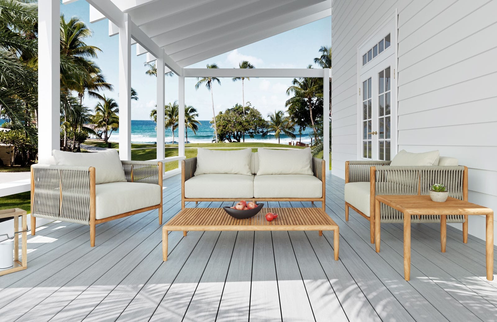 Maldives outdoor patio sofa set from Brown Jordan on a wood patio deck with tropical beachfront view