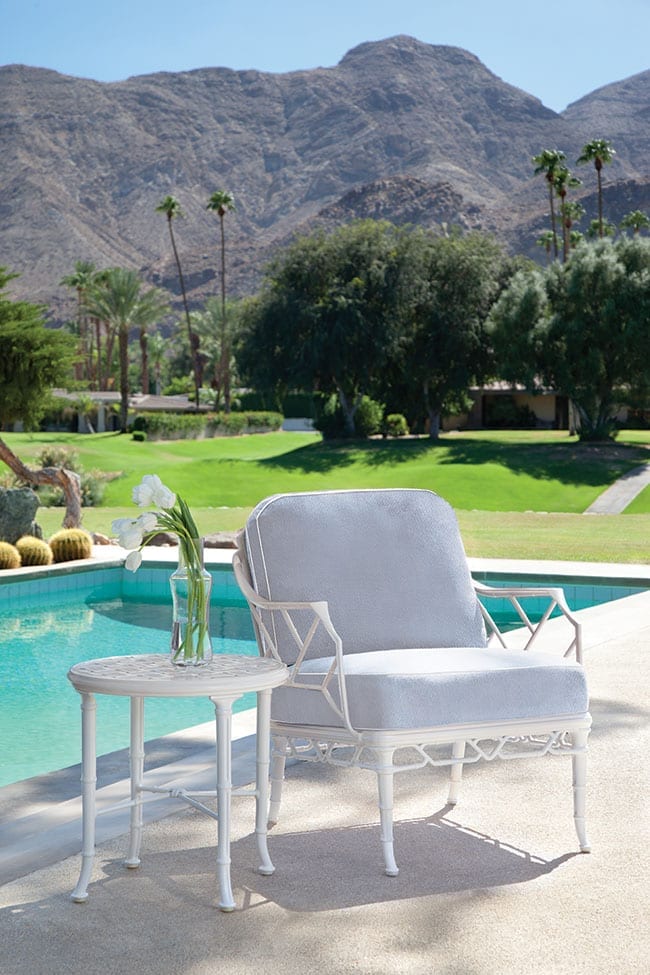 Calcutta outdoor patio lounge set from Brown Jordan in front of a pool on a patio with a beautiful view of mountains in the background